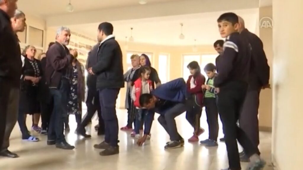 Azerbaijani civilians take refugee in schools to avoid Armenian attacks