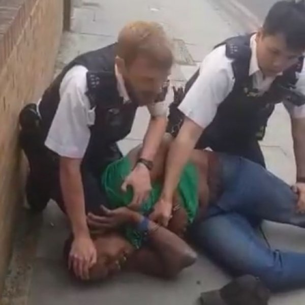 British officer suspended for kneeling on Black man's neck