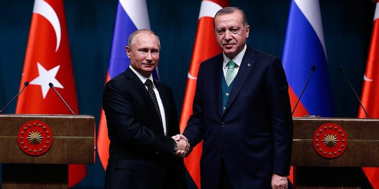 Russia's President Vladimir Putin shakes hand with Turkish President Recep Tayyip Erdogan. AA photo.