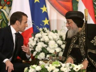 France's Macron visits bombed-out church in Cairo