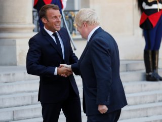 Macron’s never-ending handshake with Johnson