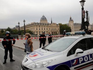 Man stabs police officer in Paris, shot dead