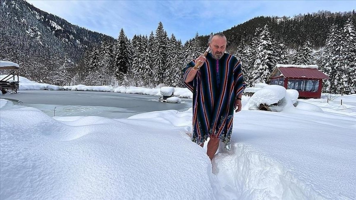 'Turkish Viking' swims in frozen lake, breaks ice with his axe