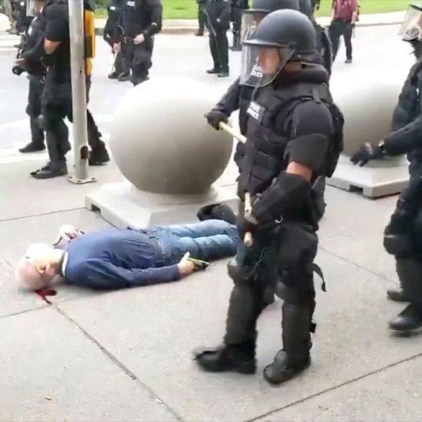 US police push 75-year-old to ground during protests