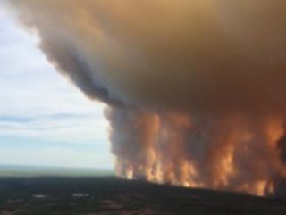 Wildfires force ten thousand to evacuate homes in Canadia