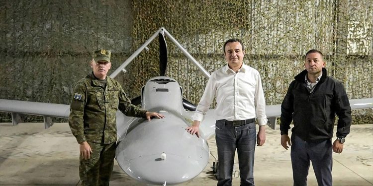 Kosovo Prime Minister Albin Kurti poses in front of the Bayraktar TB2 drone.
