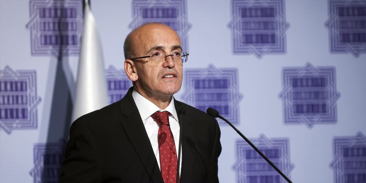Mehmet Şimşek, Turkish treasury and finance minister, speaks at the general assembly of the Banks Association of Türkiye. (AA photo)