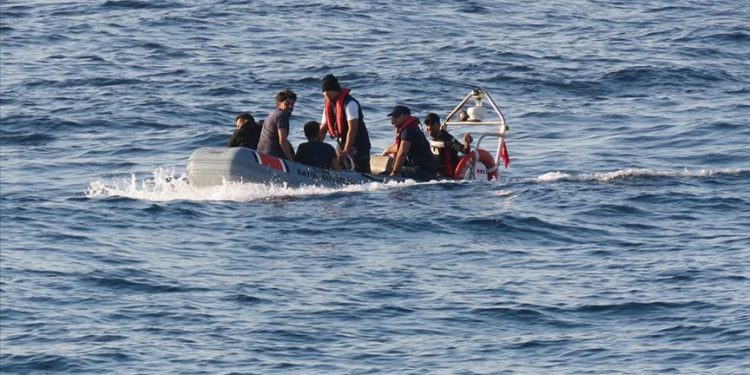Irreguler migrants are seen on a boat. (File Photo)